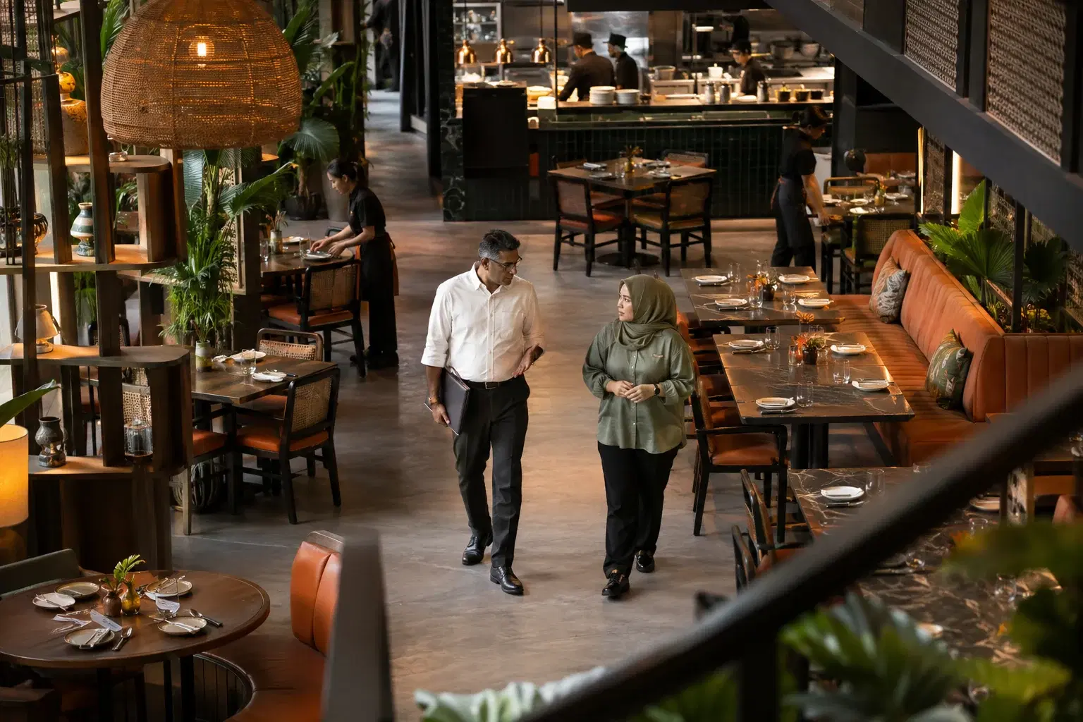 Regional operations director reviewing a restaurant with its outlet manager